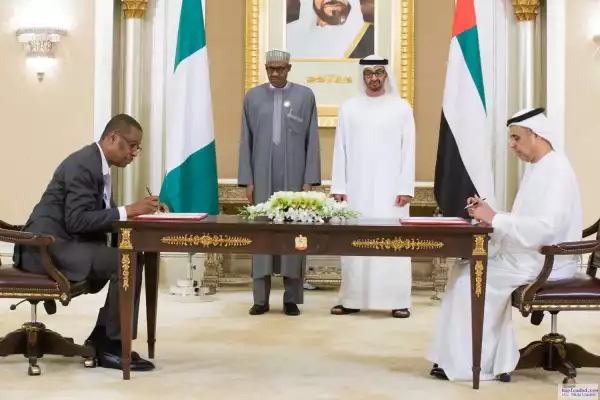 Photos From Buhari With Minister Of Finance And Trade As They Sign Deal In UAE
